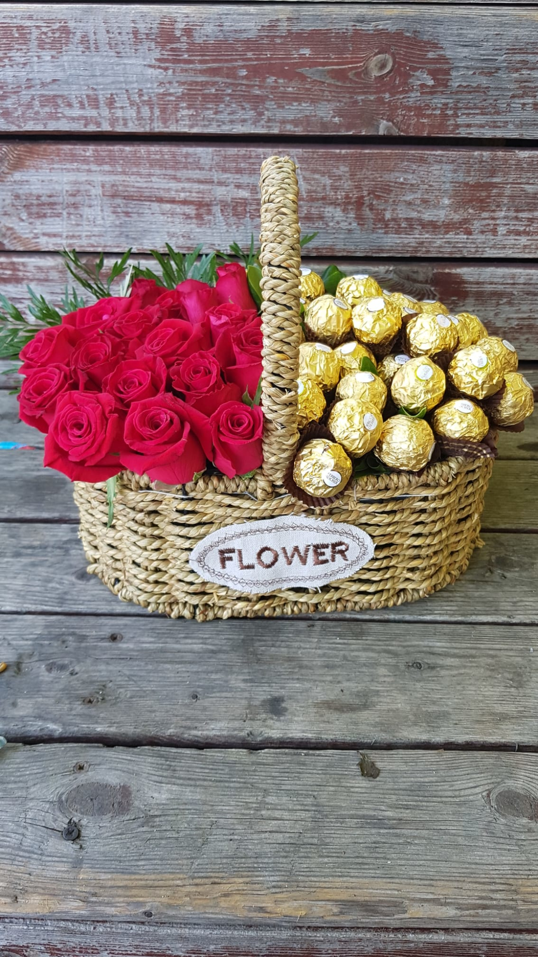 Arrangement of roses and Ferrero Rocher in a basket