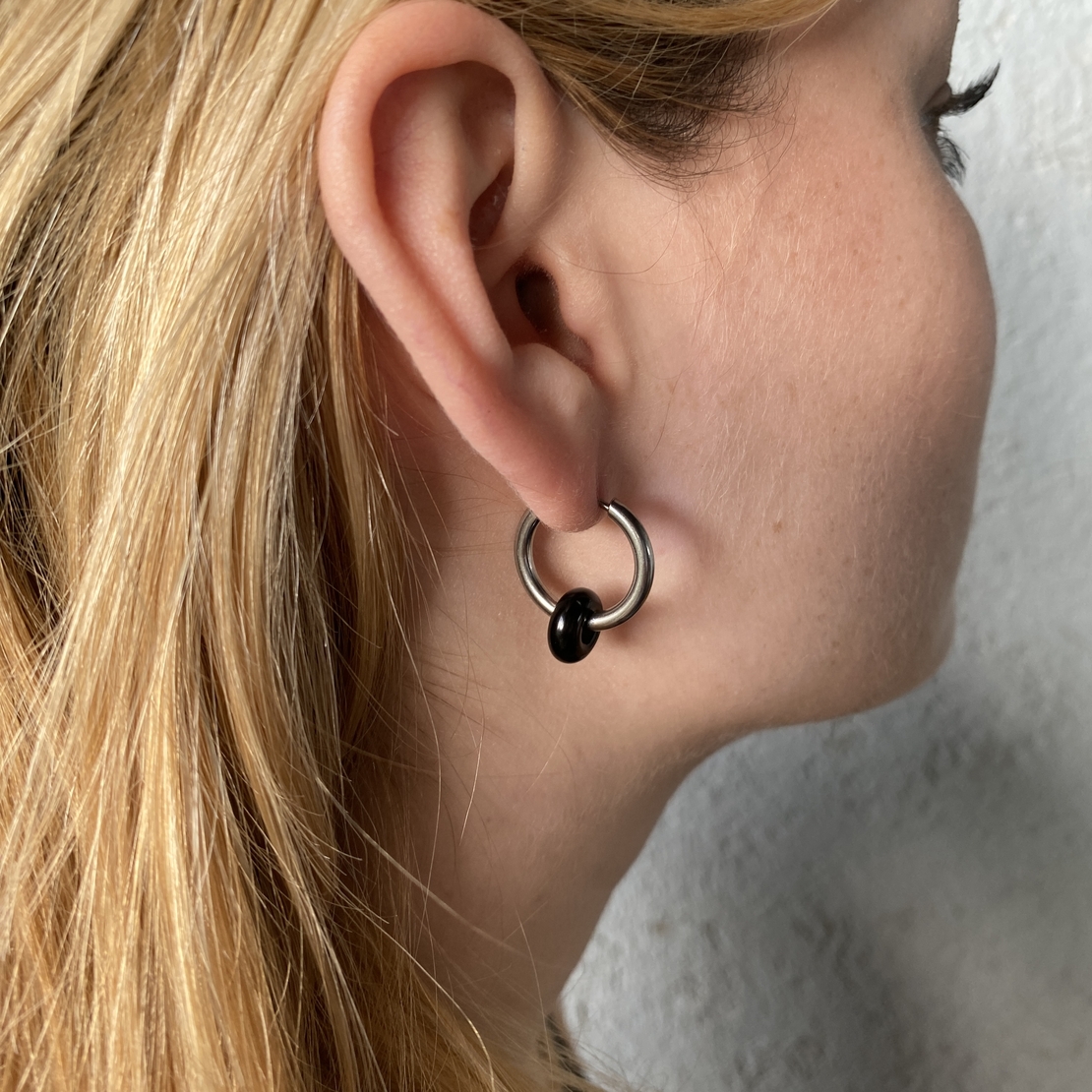 Silver plated hoop earrings with a stone bead black onyx